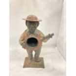 A VINTAGE CAST METAL FIGURE OF A MAN PLAYING THE GUITAR