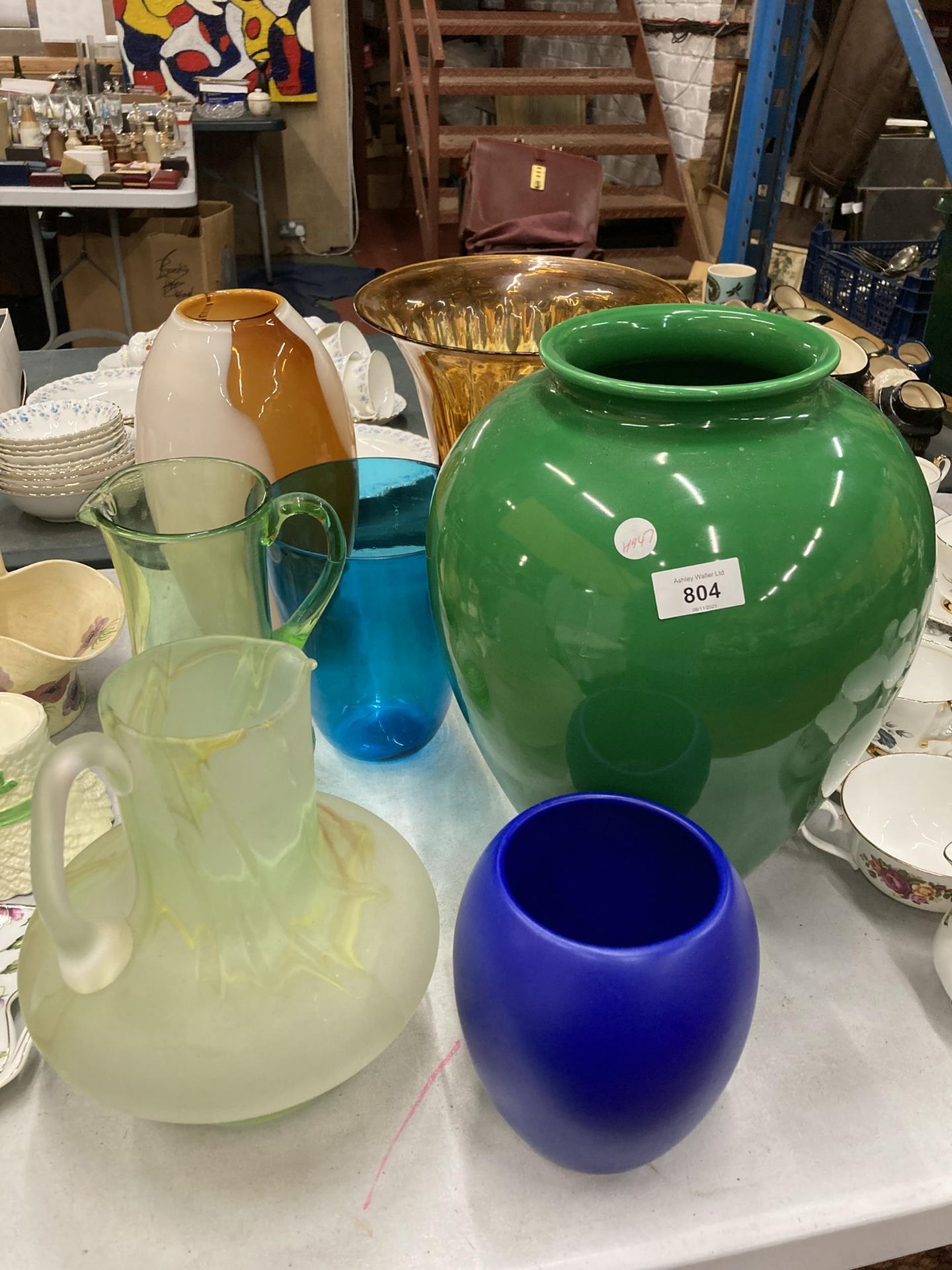 A QUANTITY OF LARGE CERAMIC AND GLASS VASES, TO INCLUDE STUDIO GLASS, PLUS TWO LARGE GLASS JUGS -