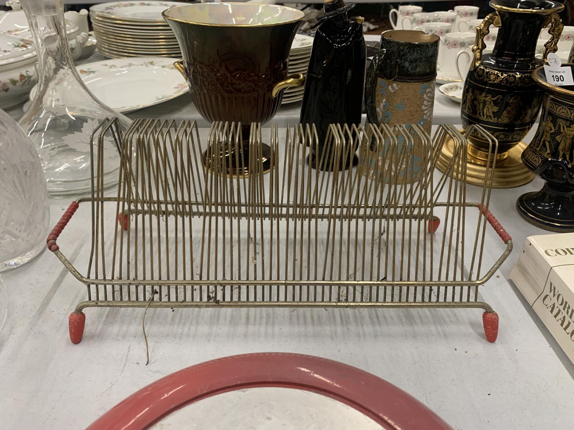 A 1960S BRASS RECORD RACK