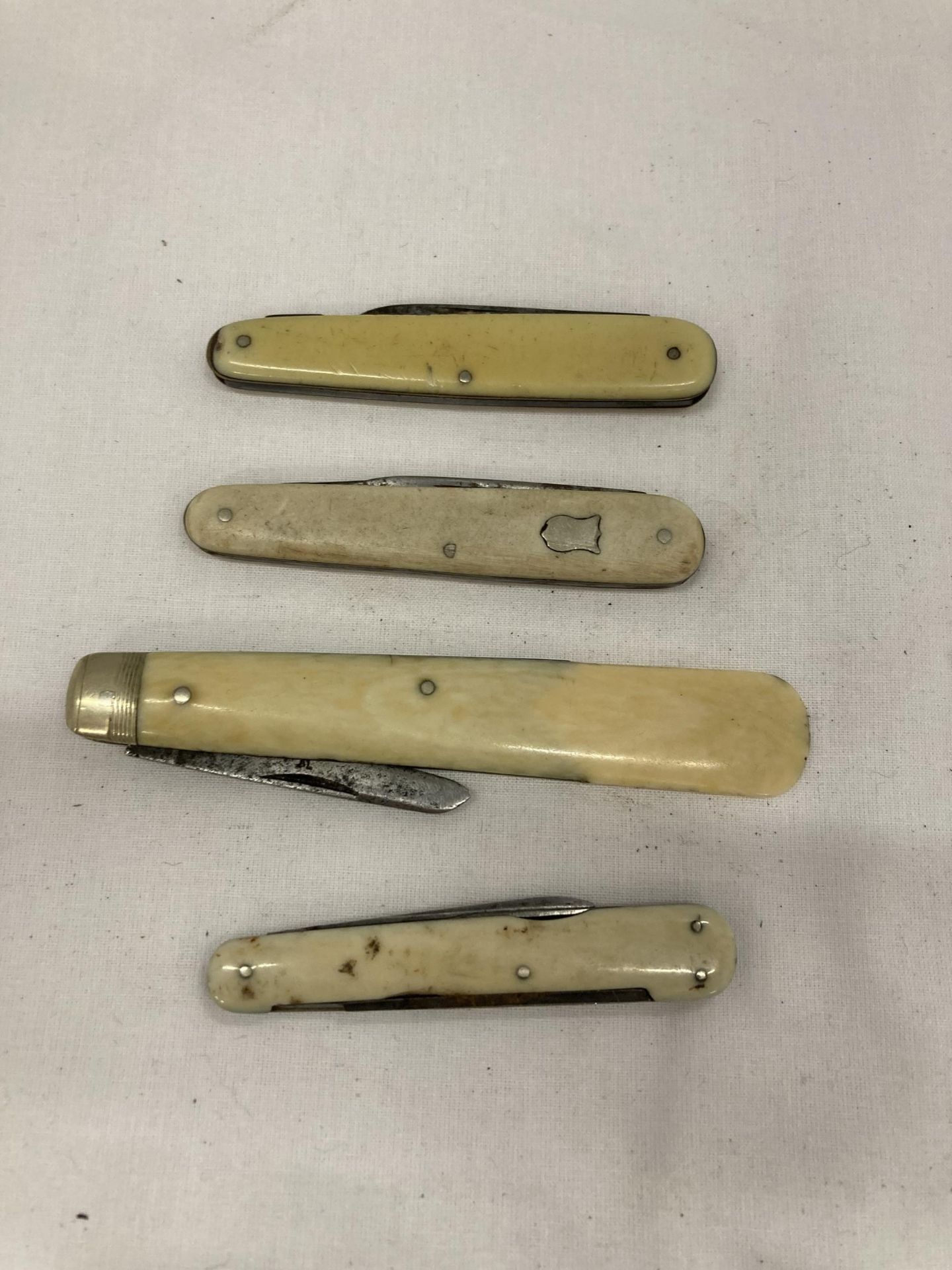 FOUR BONE HANDLED PEN KNIVES