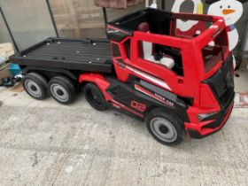 A 'SUPER CAR' BATTERY POWERED CHILDS RIDE ALONG BATTERY WAGON AND TRAILER COMPLETE WITH CHARGER,