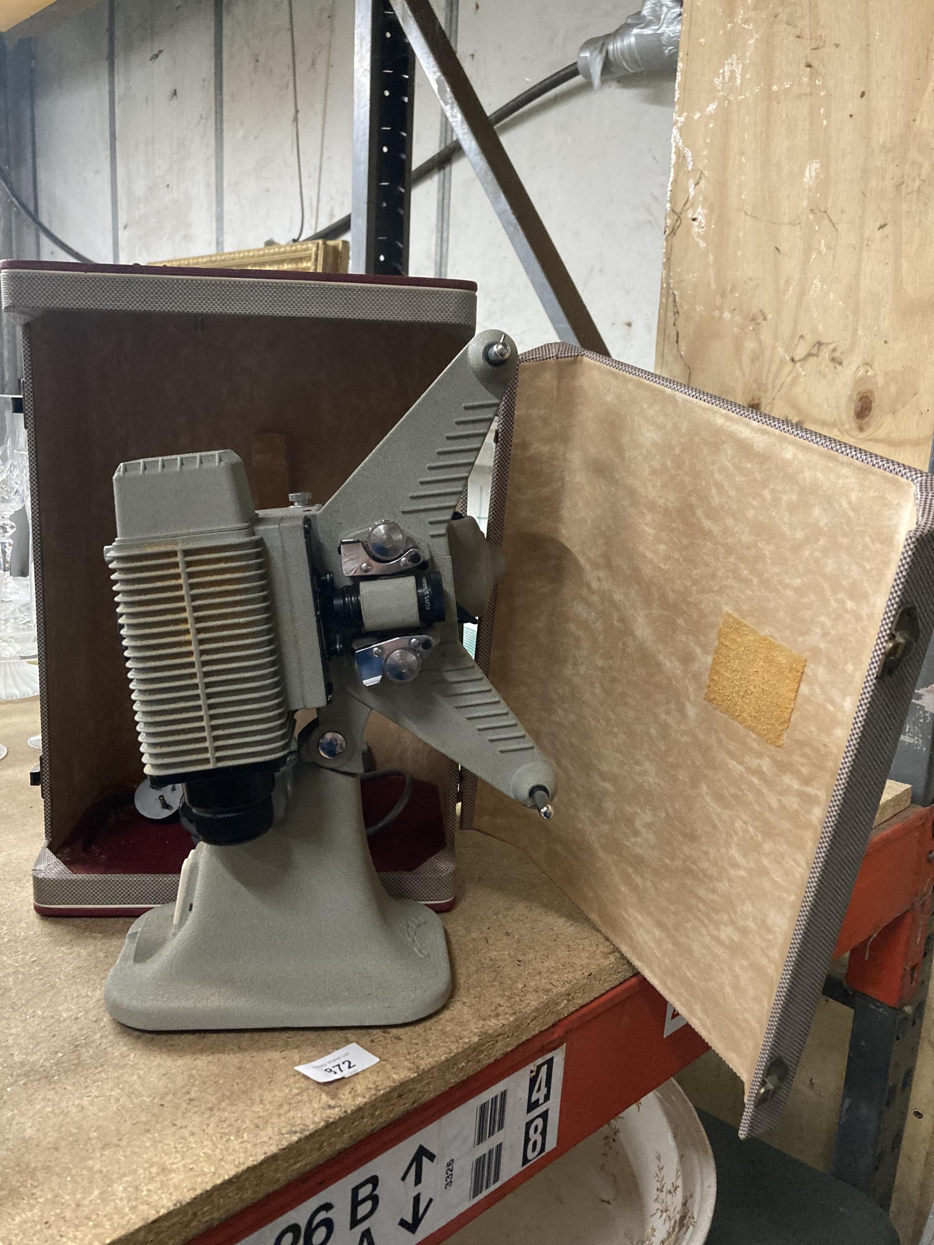 A VINTAGE ASTRO 8MM FILM PROJECTOR WITH BOX
