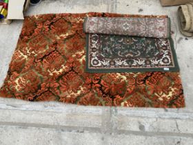 A GREEN PATTERNED RUG AND AN ORANGE PATTERNED RUG