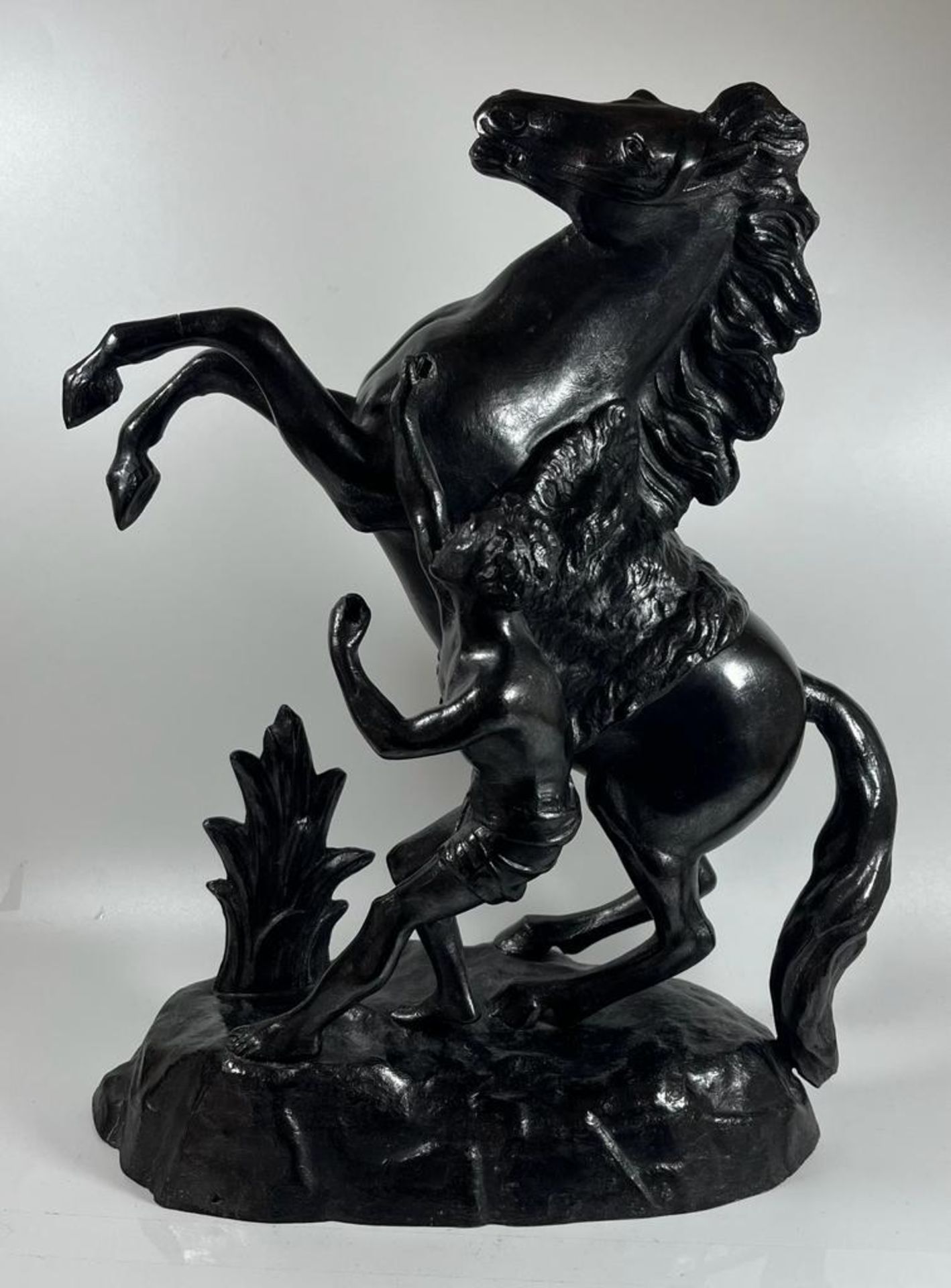 A VINTAGE PAINTED BLACK SPELTER MARLEY HORSE AND RIDER FIGURE, HEIGHT 39 CM