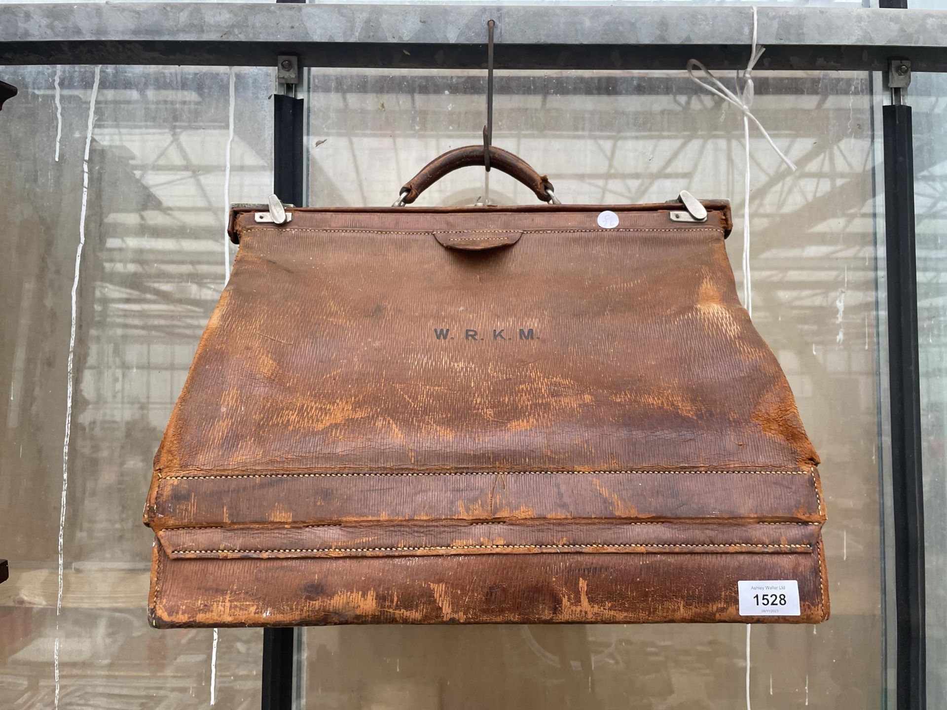 A VINTAGE LEATHER MEDICAL BAG BEARING THE INITIALS W.R.K.M