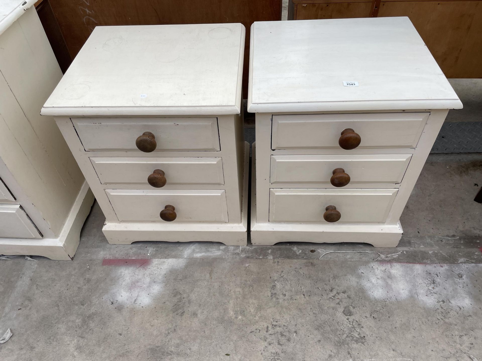 A PAIR OF PAINTED PINE BEDSIDE CHESTS