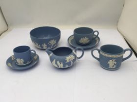 A COLLECTION OF WEDGWOOD BLUE JASPERWARE ITEMS, CUPS AND SAUCERS ETC