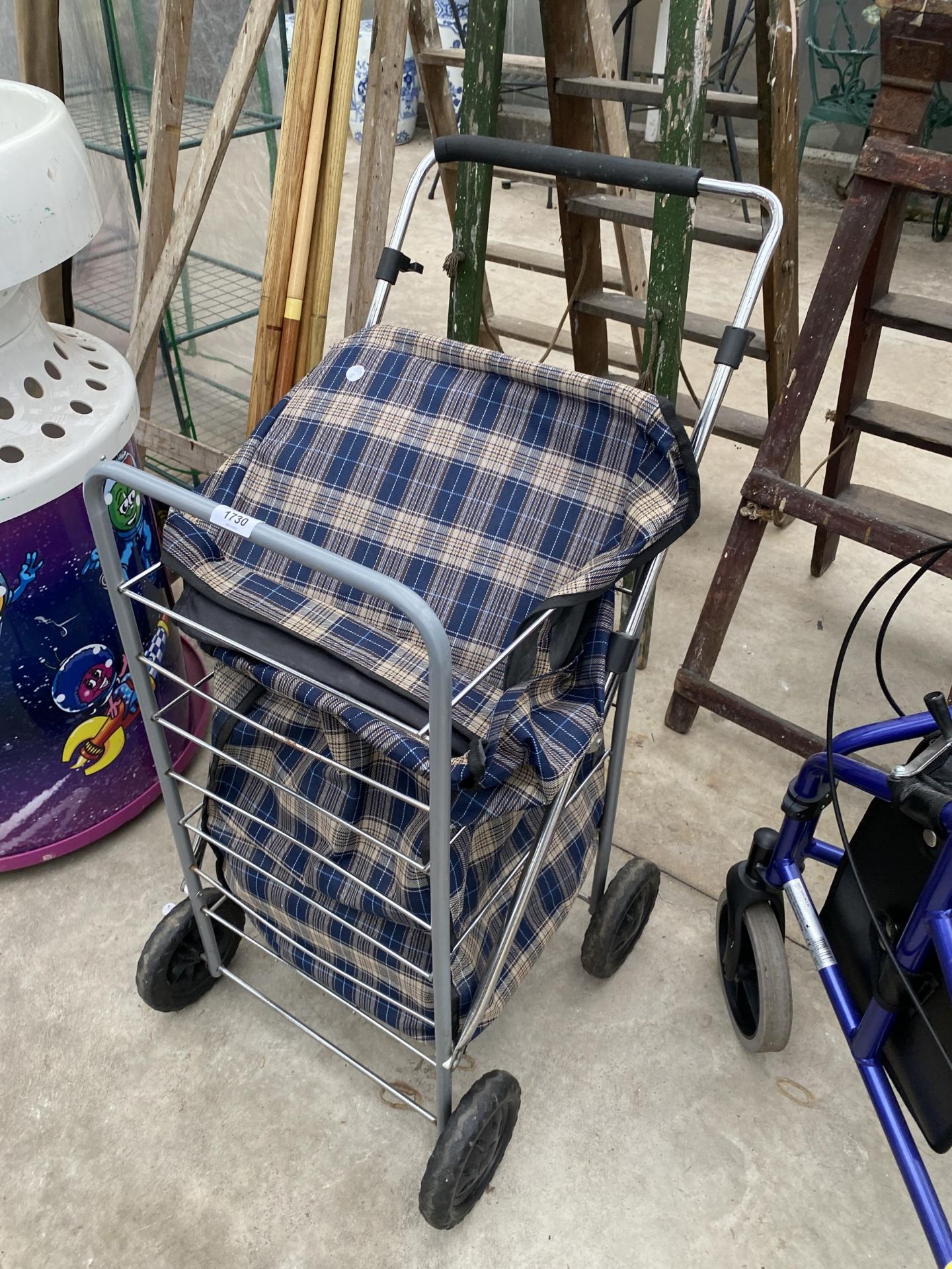 A FOUR WHEELED SHOPPING BAG TROLLEY