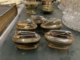 A GROUP OF FIVE VINTAGE SILVER PLATED TABLE LIGHTERS