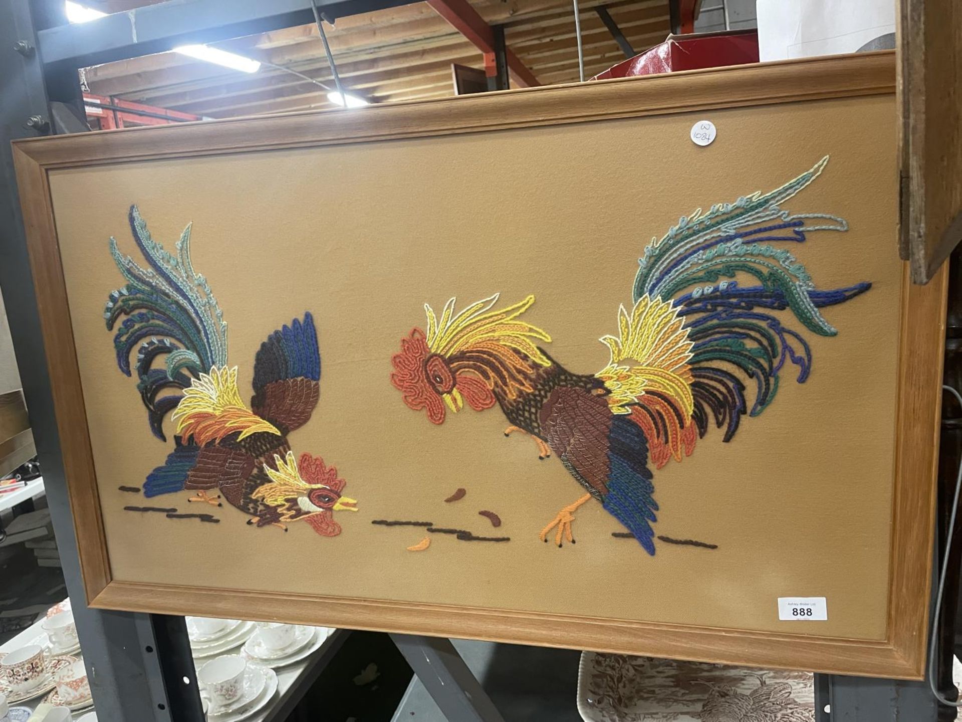 A FRAMED EMBROIDERY OF TWO FIGHTING COCKS