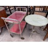 AN ONYX EFFECT TRIPOD TABLE AND A TWO TIER METALWARE TEA TROLLEY