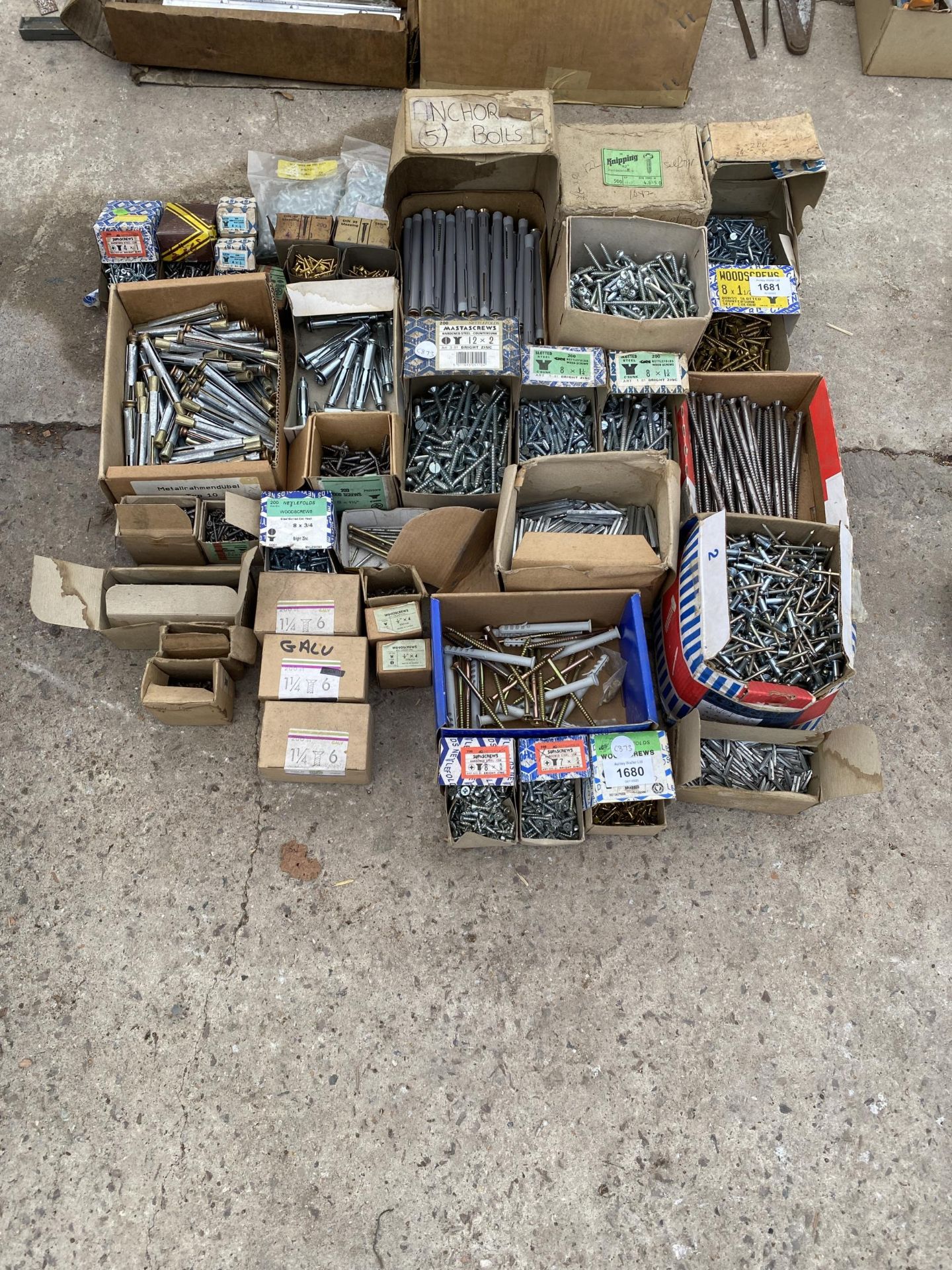 A LARGE ASSORTMENT OF HARDWARE TO INCLUDE SCREWS AND BOLTS ETC