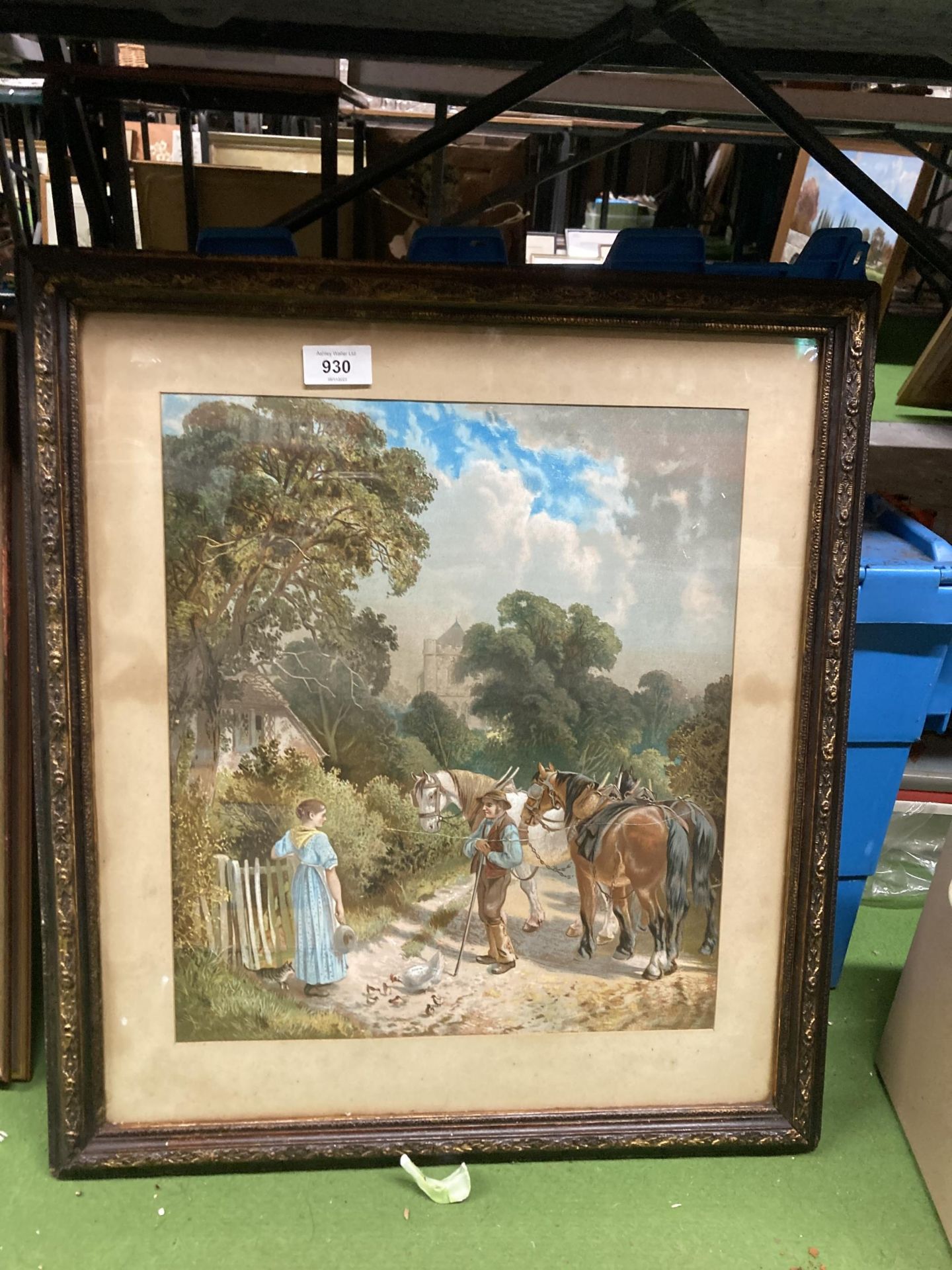 A FRAMED PRINT OF A COUNTRYSIDE SCENE