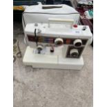 A RETRO FRISTER STAR 112 ELECTRIC SEWING MACHINE WITH COVER