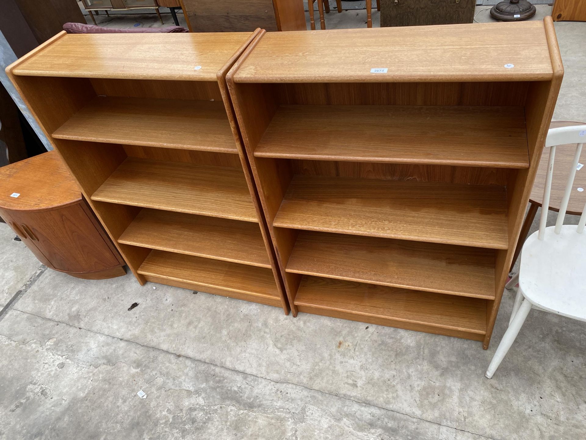 A PAIR OF TEAK OPEN FOUR TIER BOOKCASES, 30" WIDE EACH