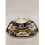A 19TH CENTURY COBALT BLUE, GILT AND HAND PAINTED FLORAL CUP, SAUCER AND SIDE PLATE TRIO