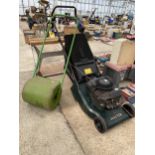 A HAYTER ROTARY LAWN MOWER WITH GRASS BOX AND A SMALL GARDEN ROLLER