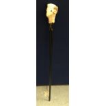 A VINTAGE EBONISED WALKING STICK WITH RAMS HEAD DESIGN TOP, SIGNED WH