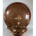 TWO VINTAGE COPPER ITEMS - A SPIRIT KETTLE WITH WOODEN HANDLE AND LARGE ARTS AND CRAFTS CIRCULAR