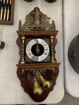 A SWISS WALL CLOCK WITH BRASS WEIGHTS