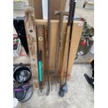 AN ASSORTMENT OF ITEMS TO INCLUDE A PASTING TABLE, A GARDEN FORK AND GOLF CLUBS ETC