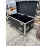 A LARGE FOUR WHEELED HARD CASED STORAGE BOX