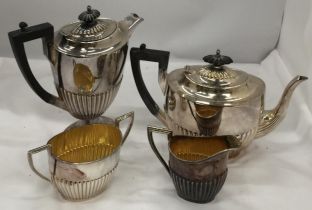 A WALKER AND HALL FOUR PIECE VINTAGE SILVER PLATED A1 EPNS TEA SET