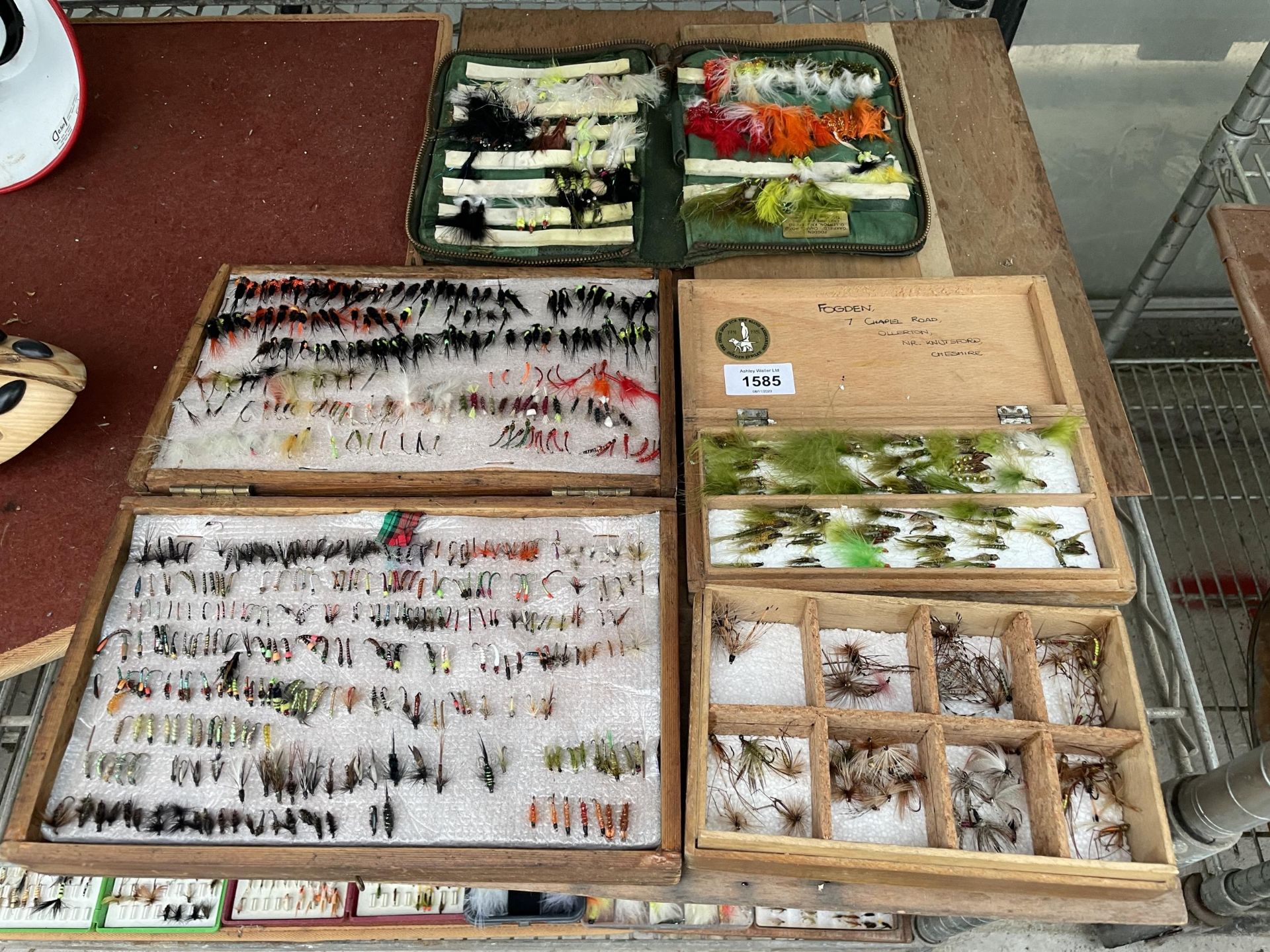 A LARGE ASSORTMENT OF CASED FLY FISHING FLIES