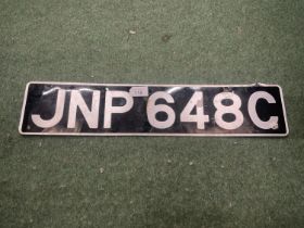 A VINTAGE DE-REGISTERED NUMBER PLATE - JNP 648C