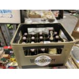 A PLASTIC CRATE OF RE-SEALABLE GERMAN BEER BOTTLES