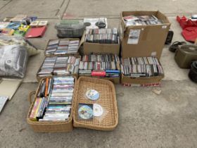A LARGE ASSORTMENT OF CDS AND DVDS ETC