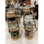 A COLLECTION OF VINTAGE GERMAN BEER STEINS WITH MUSICAL EXAMPLE