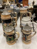 A COLLECTION OF VINTAGE GERMAN BEER STEINS WITH MUSICAL EXAMPLE