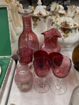 A COLLECTION OF CRANBERRY GLASS TO INCLUDE WINE GLASSES AND LARGE ETCHED DECANTER ETC