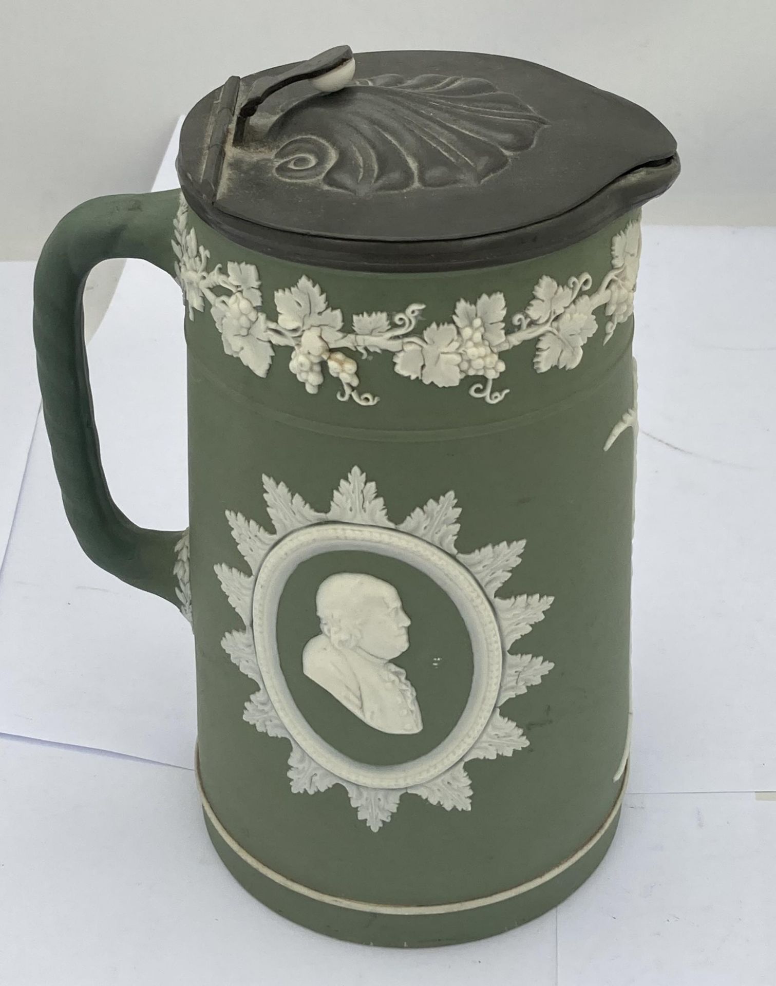 A WEDGWOOD SAGE GREEN JASPERWARE JUG WITH PEWTER JUG