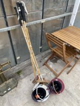 SIX VINTAGE WOODEN POLO STICKS AND TWO POLO HELMETS