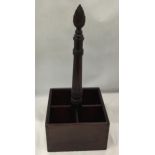 A VINTAGE MAHOGANY FOUR SECTION BOTTLE HOLDER WITH CARVED TOP