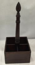 A VINTAGE MAHOGANY FOUR SECTION BOTTLE HOLDER WITH CARVED TOP