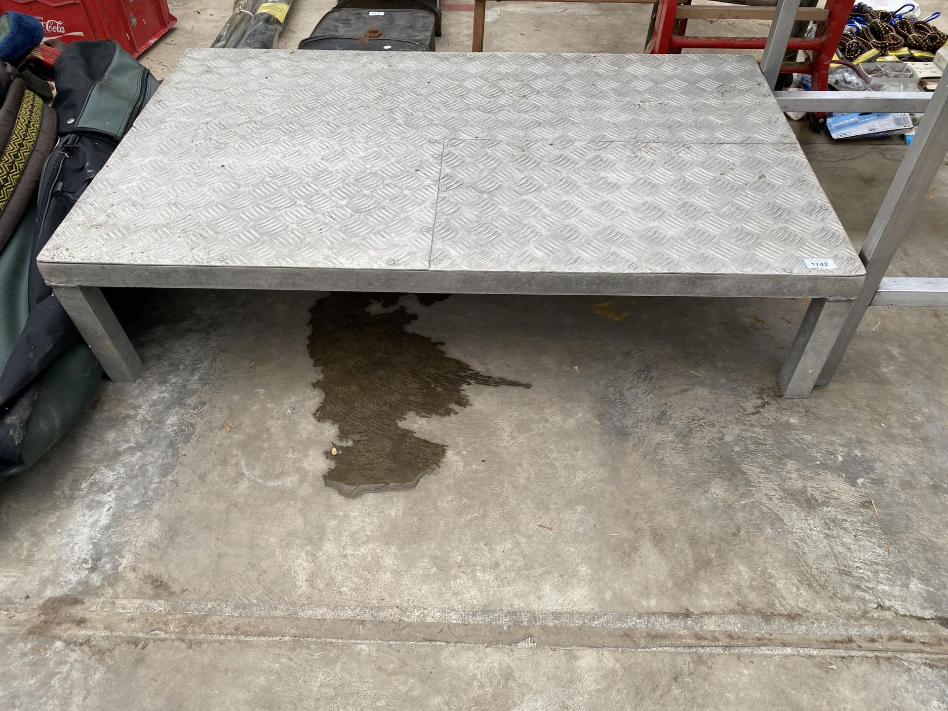 AN ALUMINIUM STEP WITH CHEQUER PLATE FLOOR