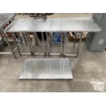 A LOW STAINLESS STEEL KITCHEN WORK UNIT