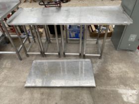 A LOW STAINLESS STEEL KITCHEN WORK UNIT