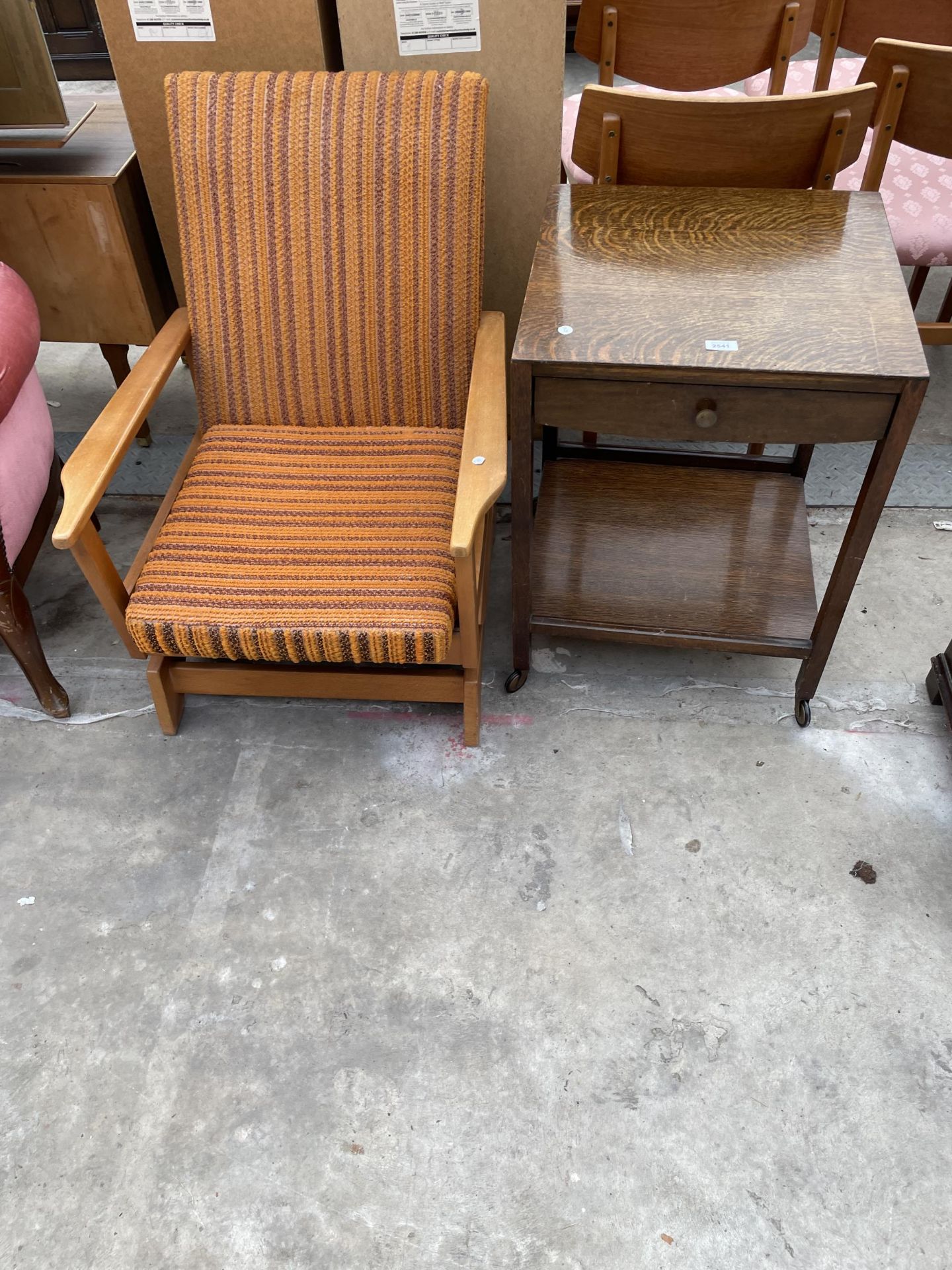 A MID 20TH CENTURY OAK TWO TIER OCCASIONAL TABLE AND FIRESIDE ROCKING CHAIR