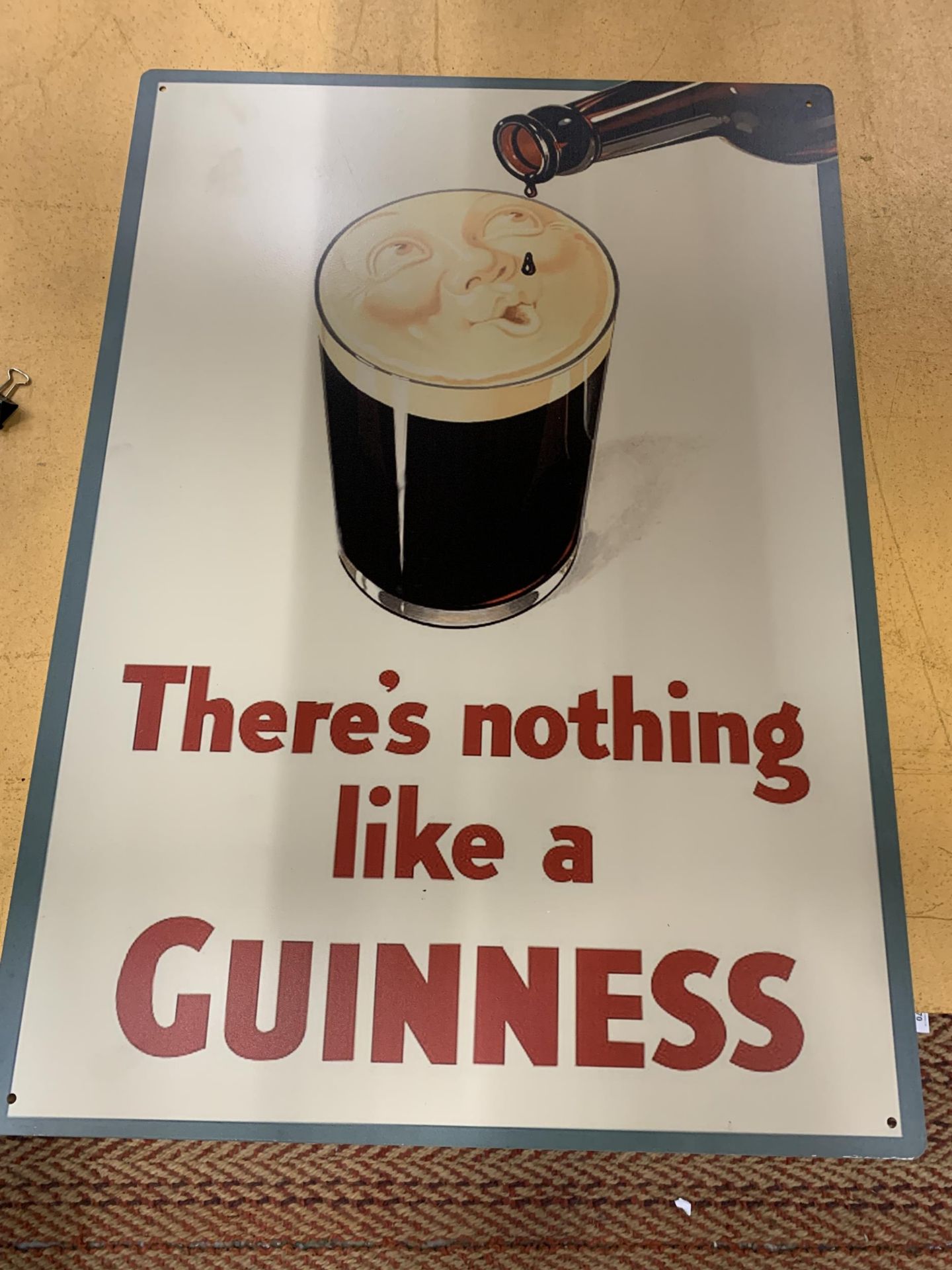 A LARGE METAL GUINNESS SIGN