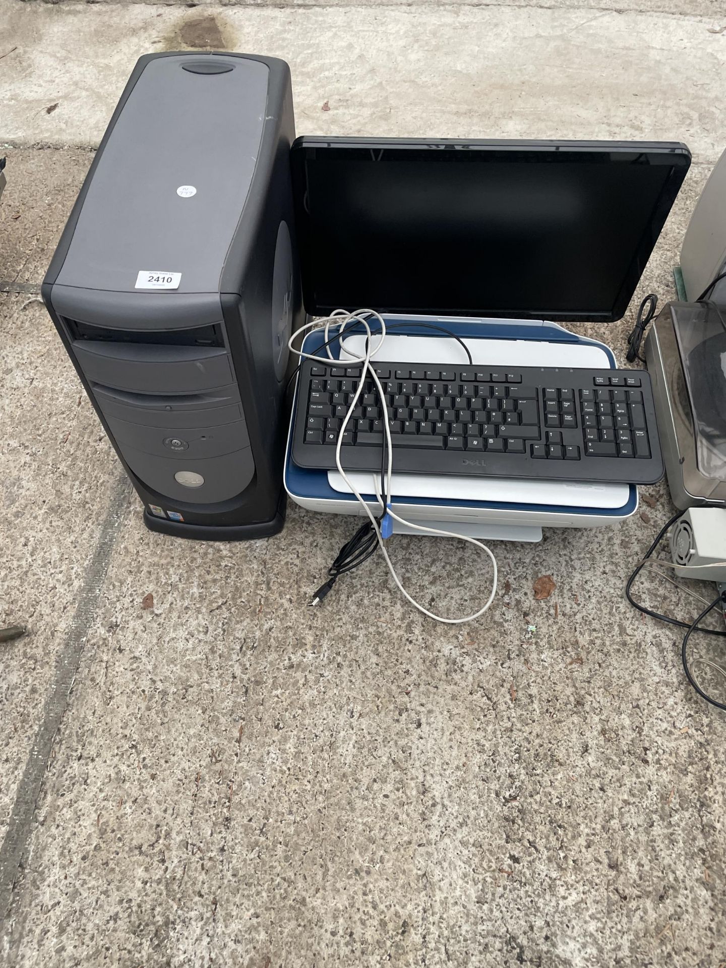 A DELL COMPUTER MONITOR, A DELL COMPUTER TOWER, A PRINTER AND KEYBOARD