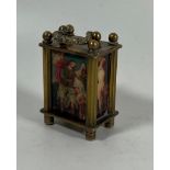 A MINIATURE BRASS WIND UP CARRIAGE CLOCK WITH CLASSICAL AND NUDE FIGURAL PANELS, HEIGHT 6CM