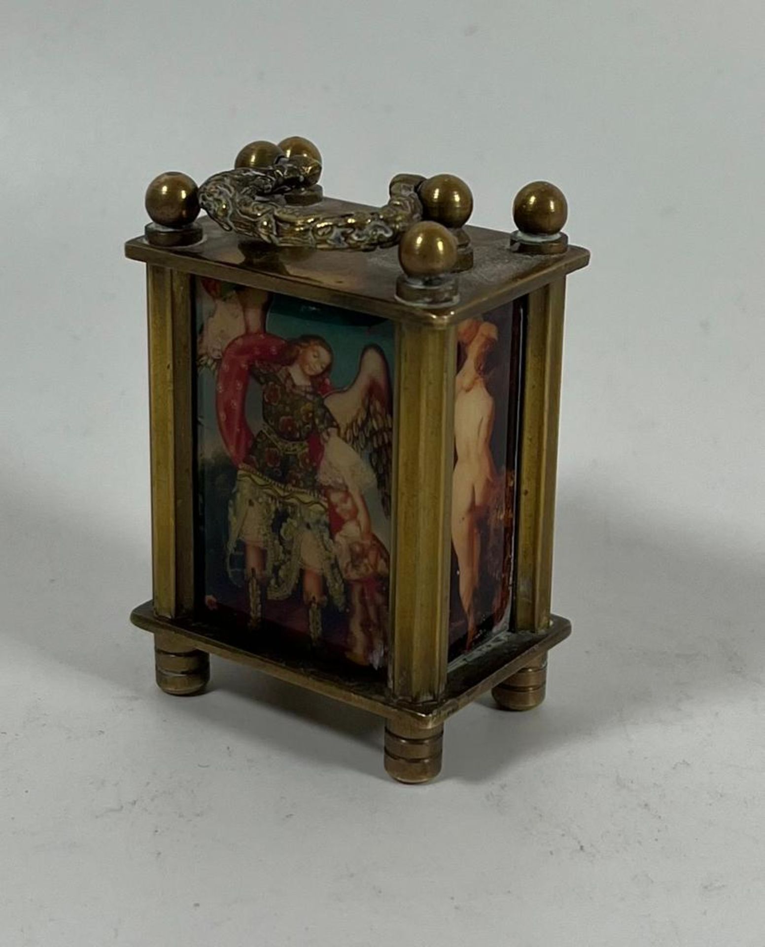 A MINIATURE BRASS WIND UP CARRIAGE CLOCK WITH CLASSICAL AND NUDE FIGURAL PANELS, HEIGHT 6CM