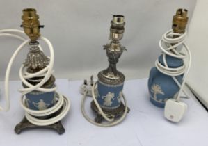 A GROUP OF THREE WEDGWOOD PALE BLUE JASPERWARE TABLE LAMPS TO INCLUDE TWO METAL BASED EXAMPLES