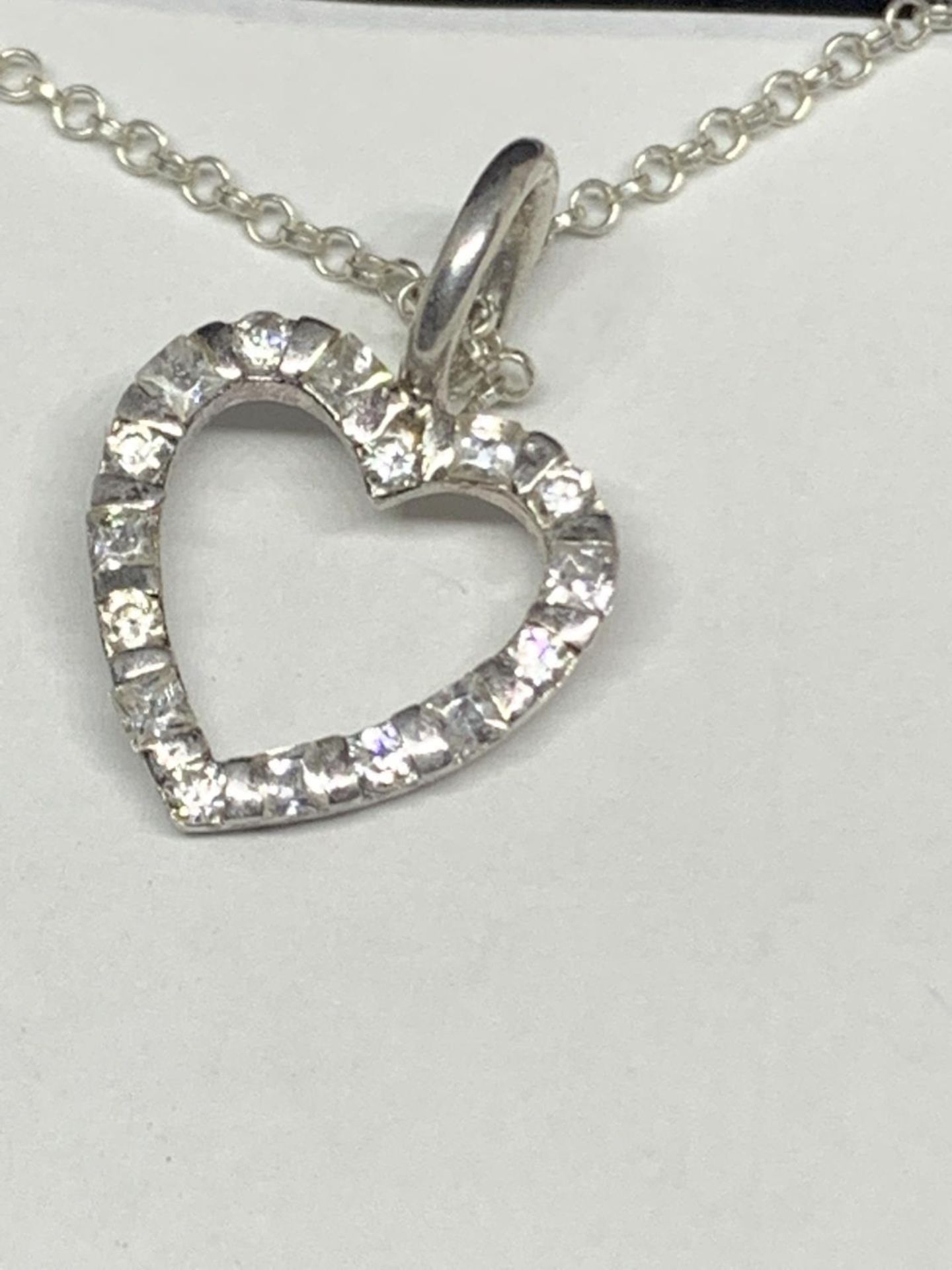 A SILVER BOXED NECKLACE WITH CLEAR STONE HEART PENDANT - Image 2 of 3