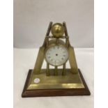 A BRASS MANTLE CLOCK FASHIONED AS CRICKET BATS, STUMPS AND BALL -A/F NO MOVEMENT HEIGHT 22CM