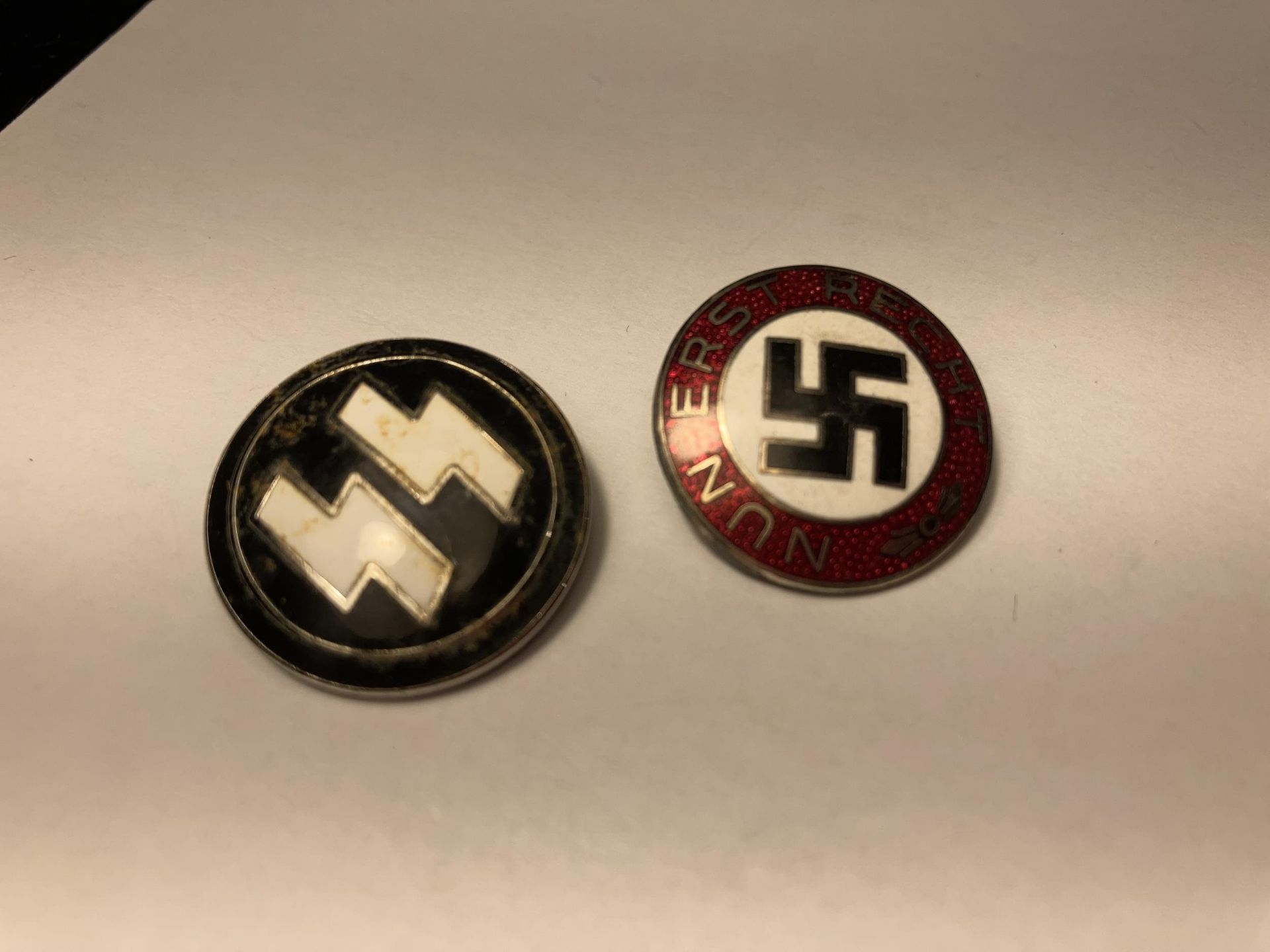 TWO ENAMEL BADGES